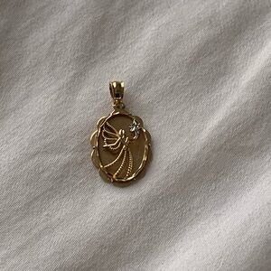 Vintage solid 10k yellow gold angel pendant.